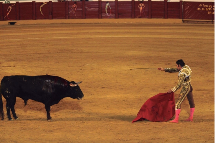 Cayetano Rivera took off his shoes to bullfight with nibble his second bull which he killed with an accurate sword thrust.